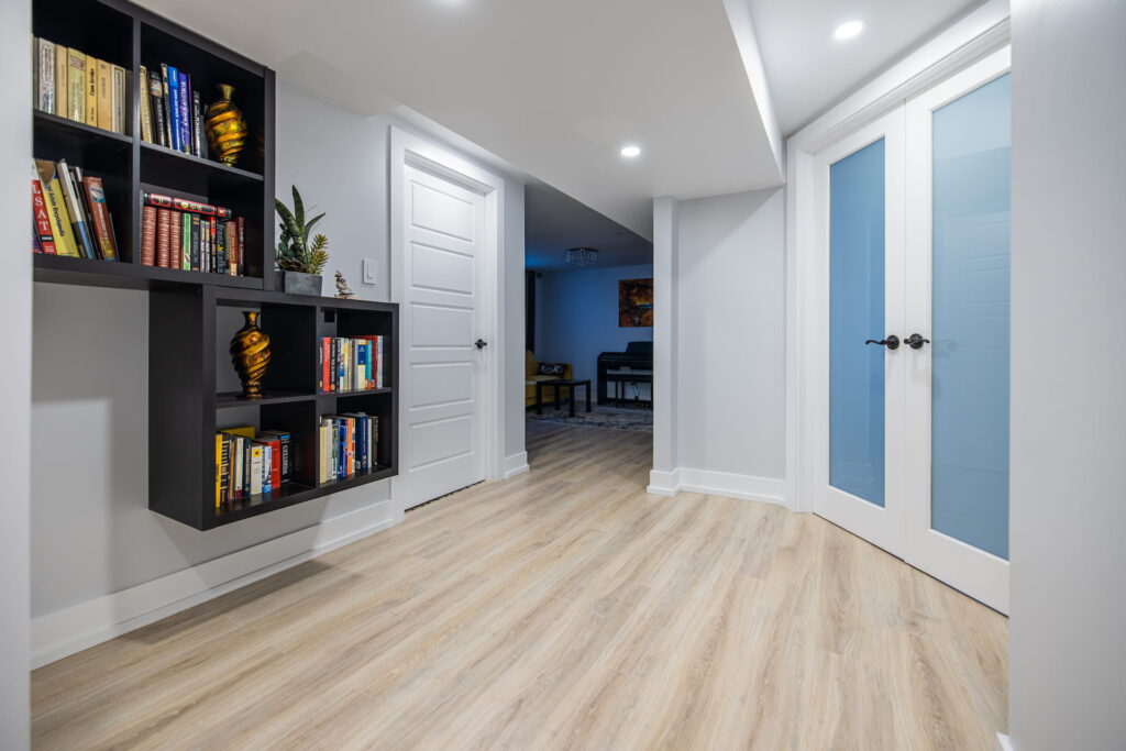 basement renovation liminate flooring wall book shelves