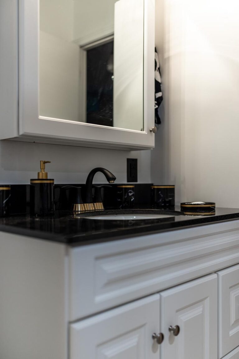 Bathroom Renovation In Ottawa Lwhite Vanity With Black Top And Black Faucet White Linen Tower 768x1151