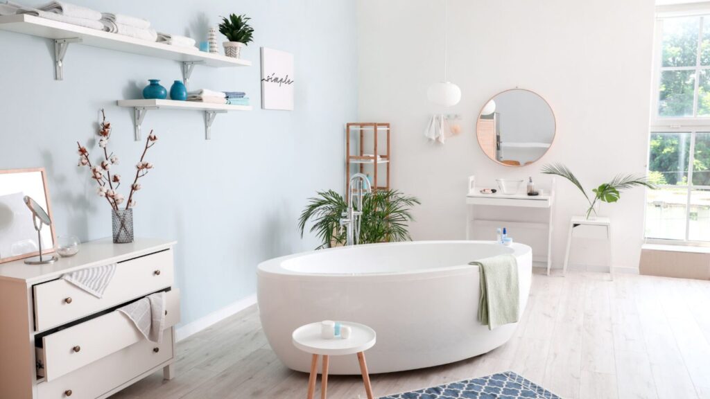 Standalone bath tub in the middle of a bathroom set in white colors