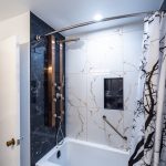 Bathroom renovation in Ottawa acrylic tub and tile walls shower panel with jets