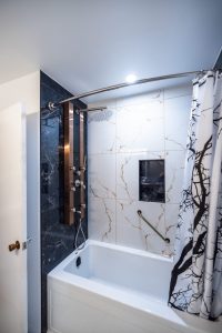 Bathroom renovation in Ottawa acrylic tub and tile walls shower panel with jets